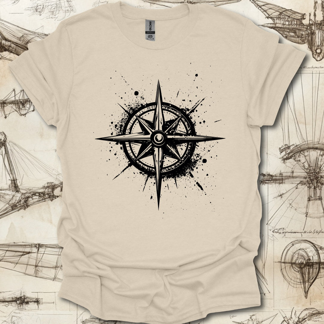 Grungy black compass rose with ink splatter design on steampunk-themed T-shirt