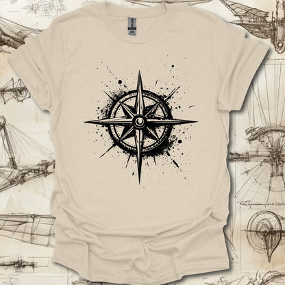 Grungy black compass rose with ink splatter design on steampunk-themed T-shirt