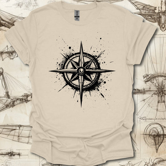 Grungy black compass rose with ink splatter design on steampunk-themed T-shirt