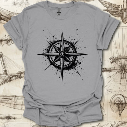 Grungy black compass rose with ink splatter design on steampunk-themed T-shirt