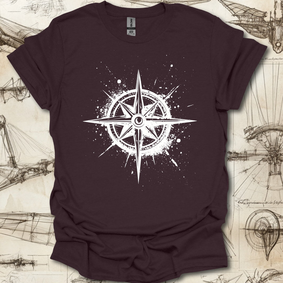 Grungy black compass rose with ink splatter design on steampunk-themed T-shirt